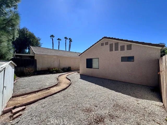 a front view of a house with a sitting area