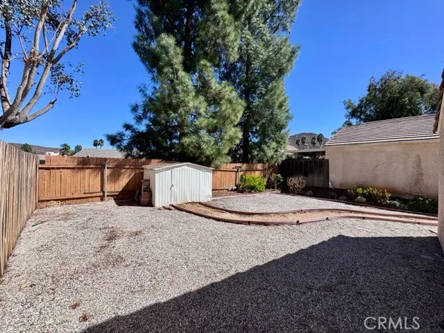 a view of a patio with table and chairs