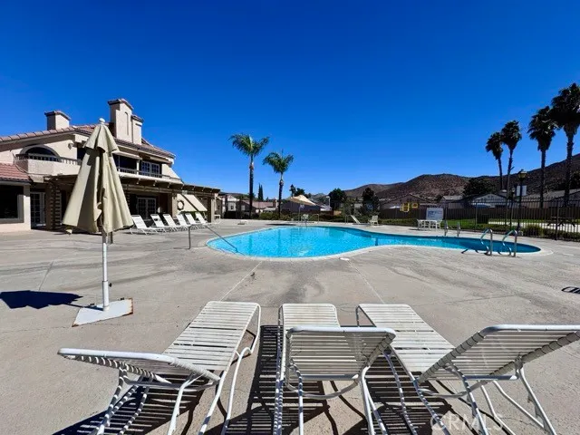 a view of a swimming pool with a patio