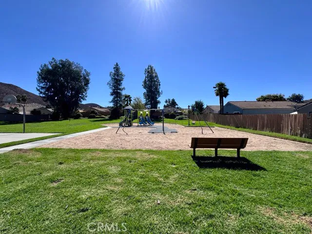 a view of a park with swings and slides