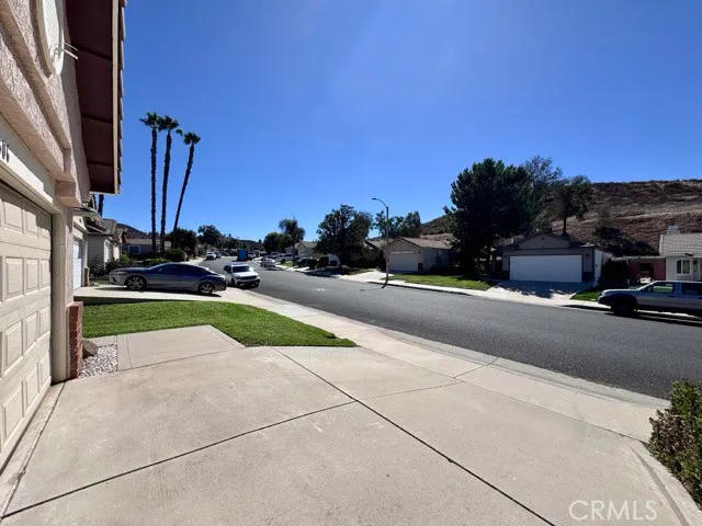 a view of a street with cars on the road