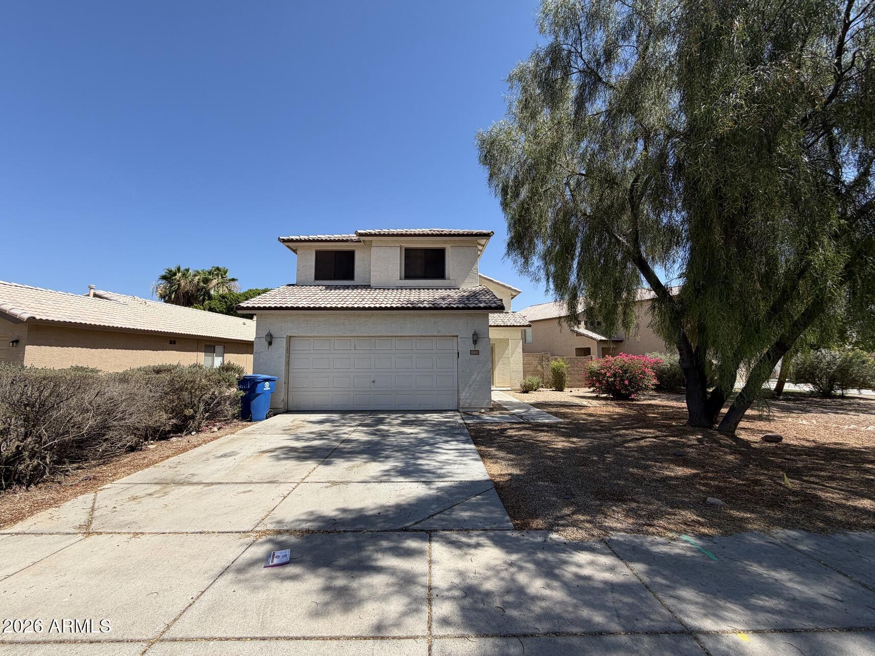10807 West Monte Vista Road Avondale, AZ 85392 - Photo 1 of 33 a front view of a house with a yard