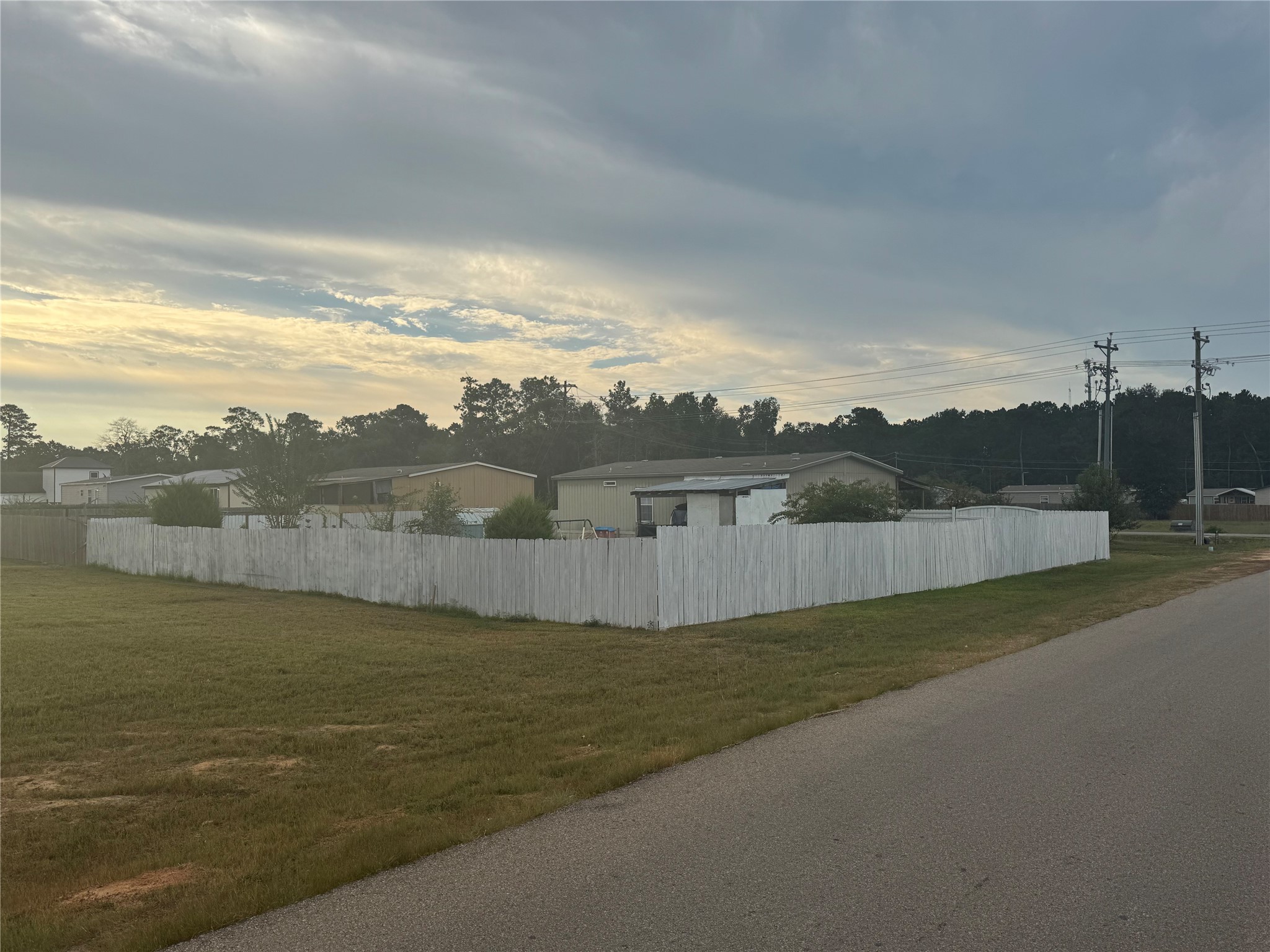 17675 Highway 105 Conroe, TX 77306 - Photo 4 of 6 a view of a lake with a big yard