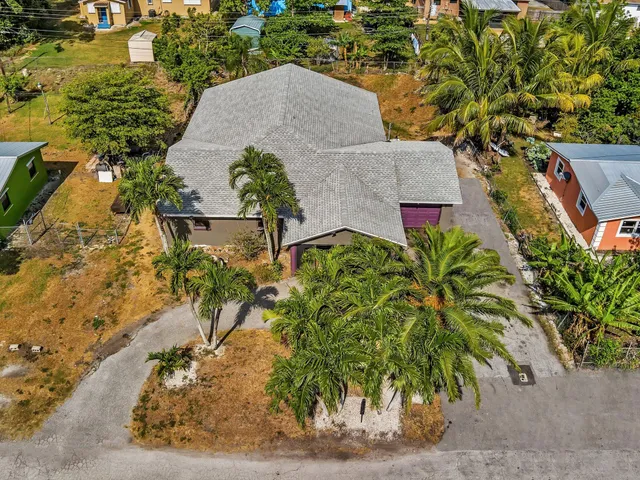 an aerial view of residential building and lake