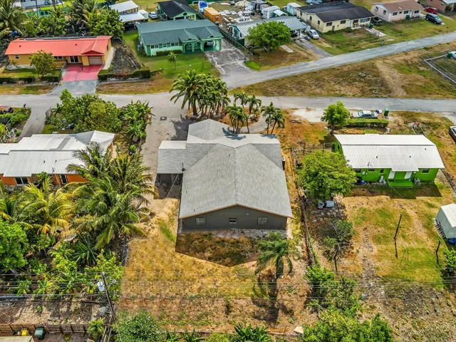 an aerial view of residential building and ocean