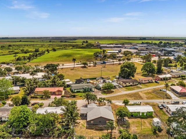 an aerial view of residential building and lake