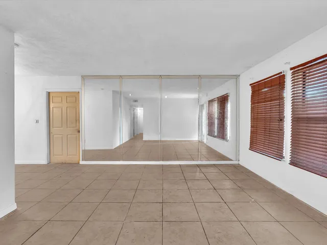 a view of an empty room and window