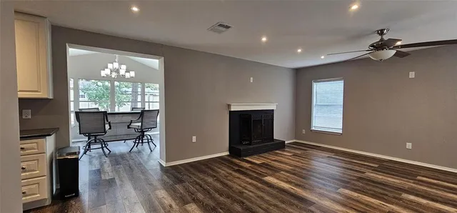 a view of a livingroom with furniture and a window