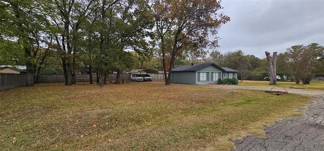 a view of house with outdoor space and sitting area