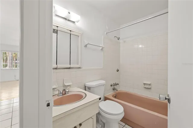 an empty room with fan and ceiling fan