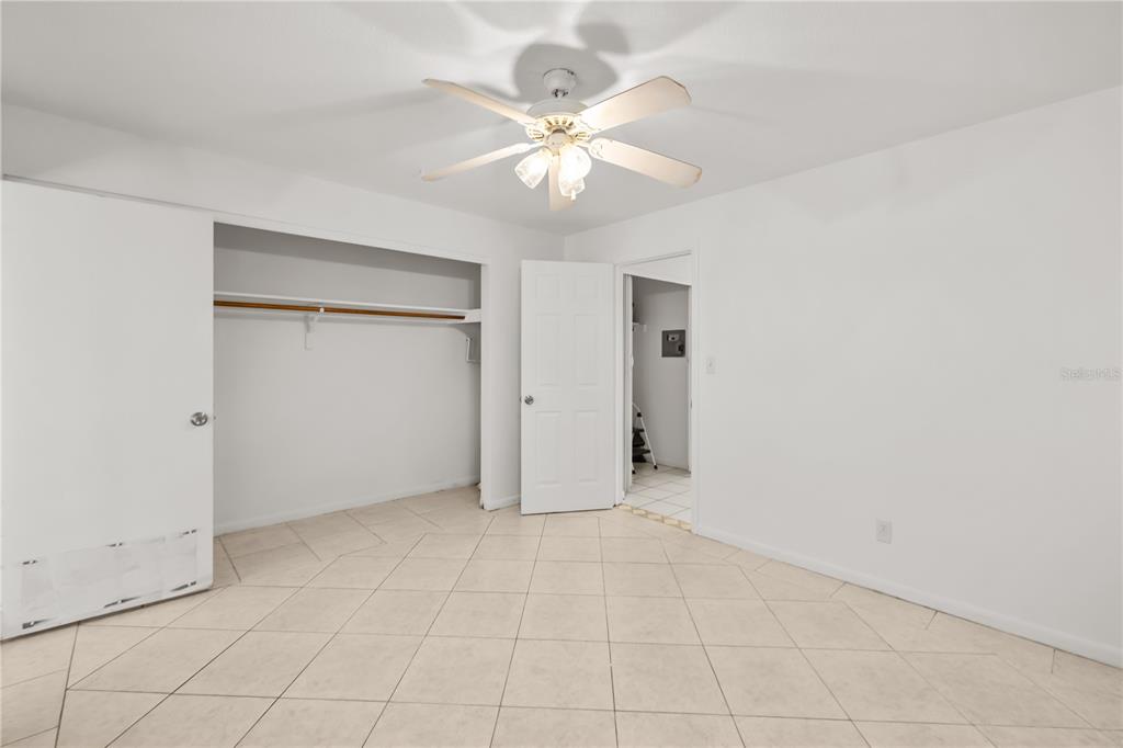 2353 Shelley Street, Unit 5 Clearwater, FL 33765 - Photo 17 of 21 an empty room with fan and ceiling fan