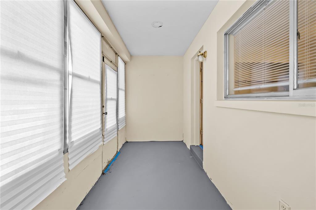 2353 Shelley Street, Unit 5 Clearwater, FL 33765 - Photo 21 of 21 a view of a hallway with wooden floor and windows