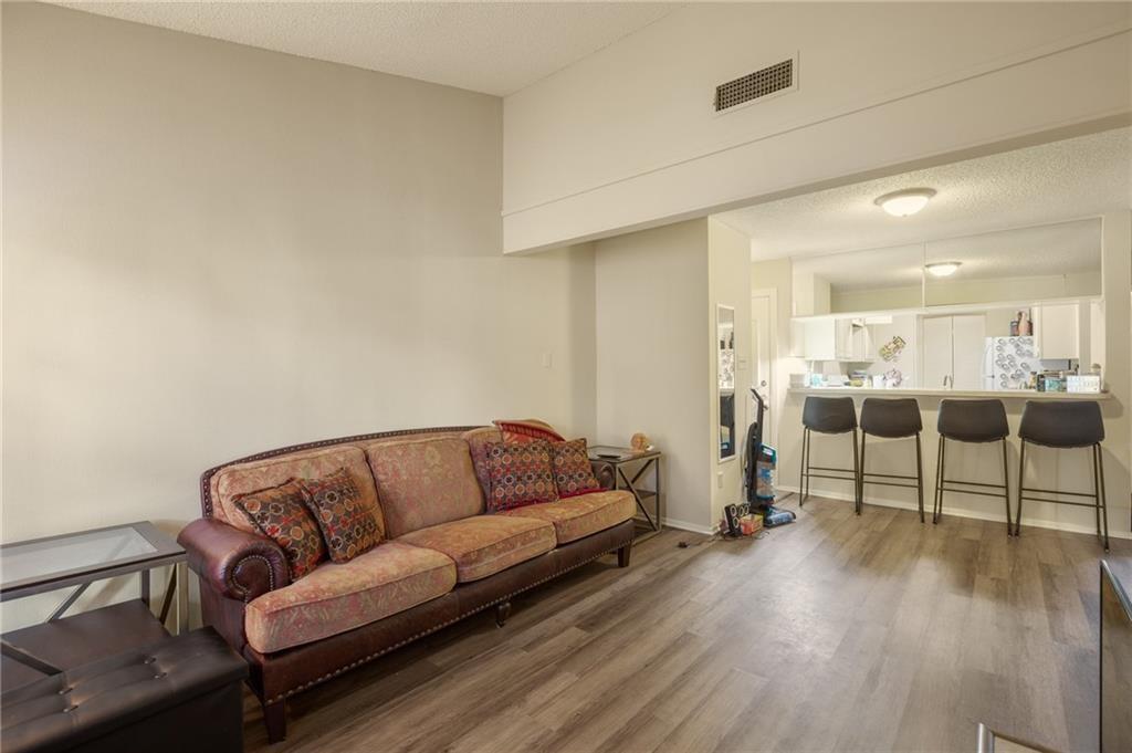 806 West 24th Street, Unit 228 Austin, TX 78705 - Photo 2 of 6 a living room with furniture and a couch