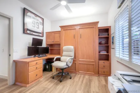 a workspace with furniture and wooden floor