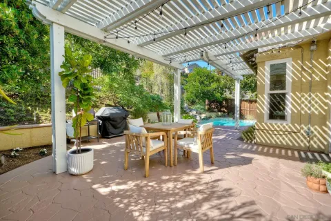 a dining room with furniture and a garden