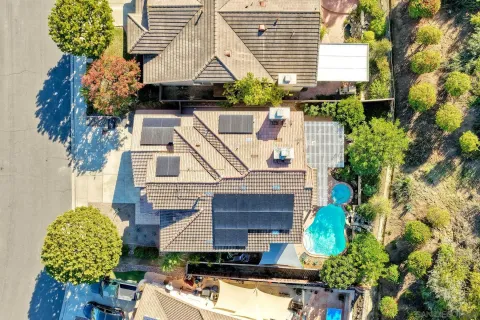 an aerial view of multiple houses with yard