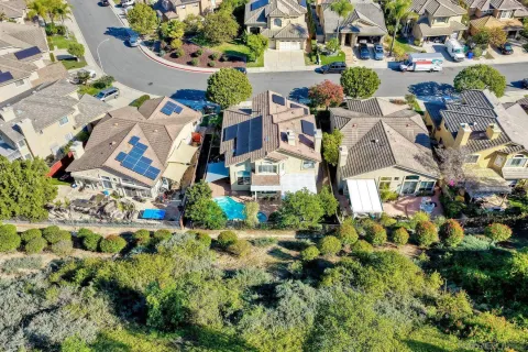 an aerial view of a house with a garden and plants