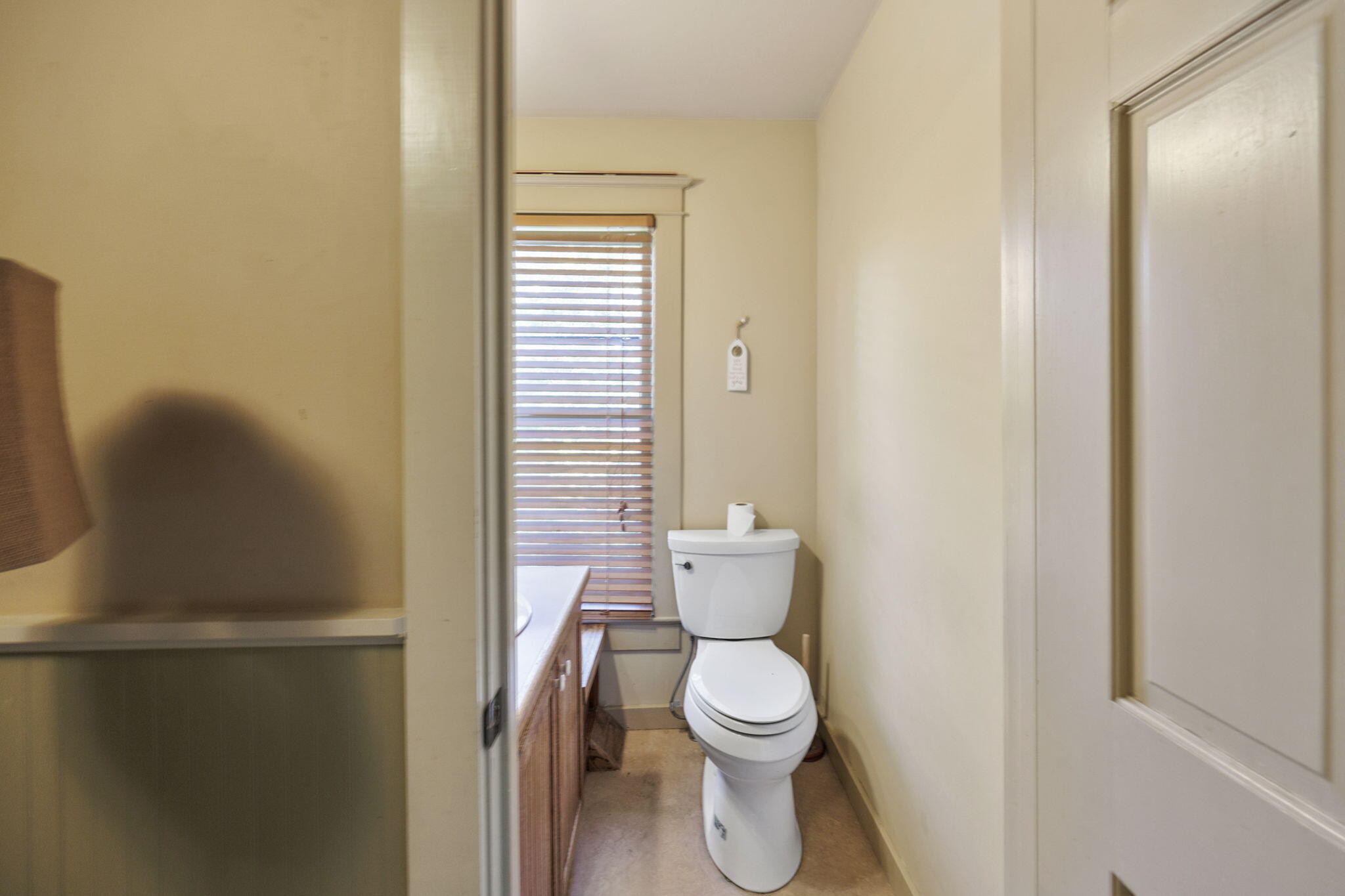 75 Wimer Street Ashland, OR 97520 - Photo 26 of 44 a white toilet sitting next to a bathroom sink
