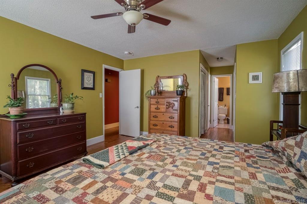 18100 Barnhardt Road Davidson, NC 28036 - Photo 14 of 29 a bedroom with a bed and a dresser