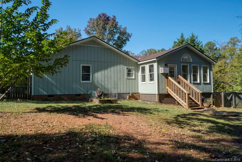 18100 Barnhardt Road Davidson, NC 28036 - Photo 23 of 29 a view of a house with a yard and large trees