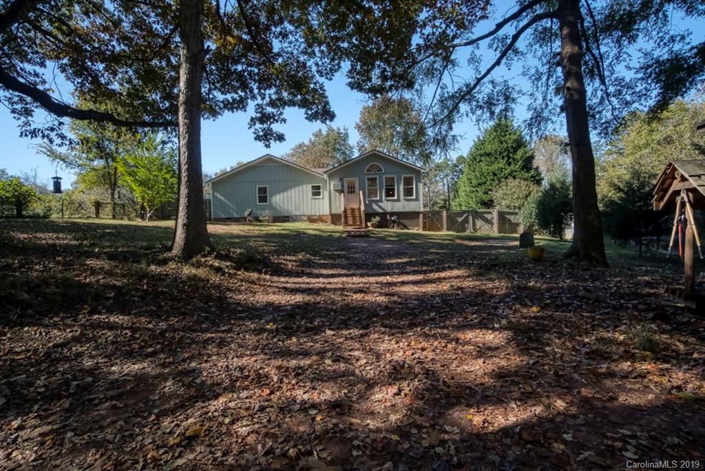 18100 Barnhardt Road Davidson, NC 28036 - Photo 24 of 29 a front view of a house with a yard