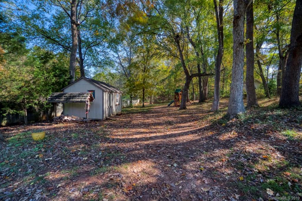 18100 Barnhardt Road Davidson, NC 28036 - Photo 26 of 29 a house view with a backyard space