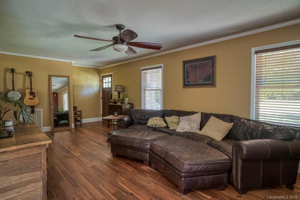 18100 Barnhardt Road Davidson, NC 28036 - Photo 4 of 29 a living room with furniture and wooden floor