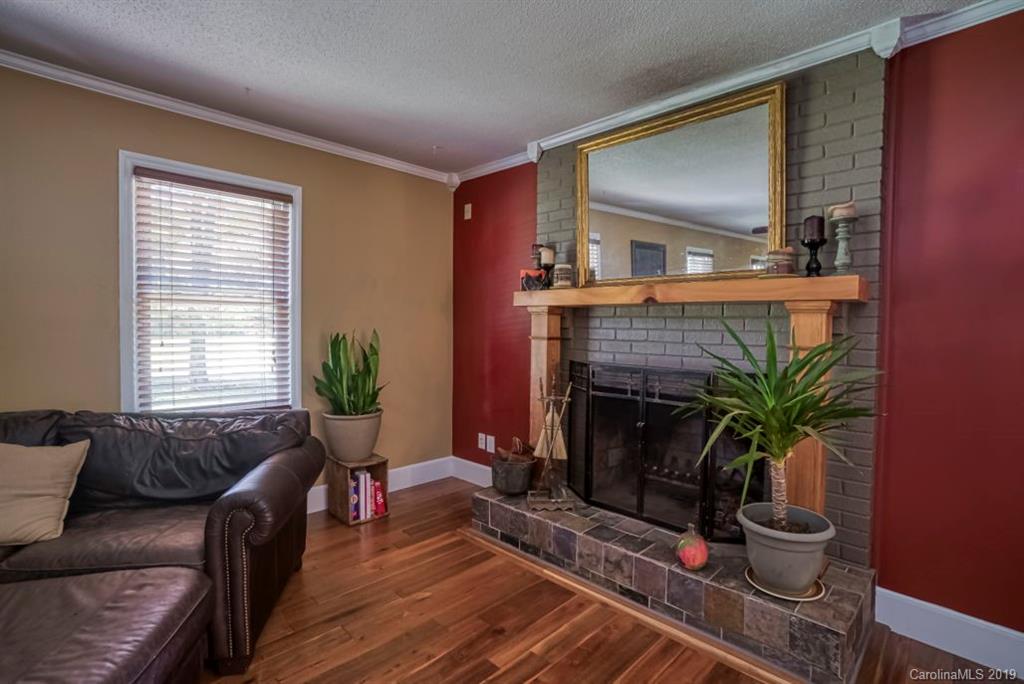 18100 Barnhardt Road Davidson, NC 28036 - Photo 6 of 29 a living room with furniture and a fireplace