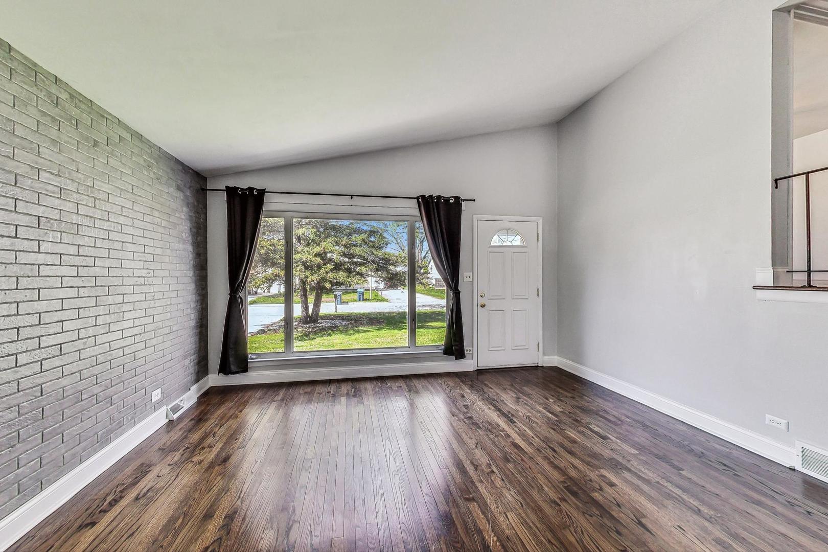 509 North Willow Road Elmhurst, IL 60126 - Photo 7 of 26 wooden floor in an empty room with a window