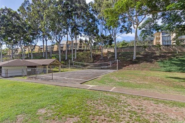 a front view of a building with a garden