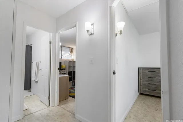 a bedroom with a bed and flat screen tv