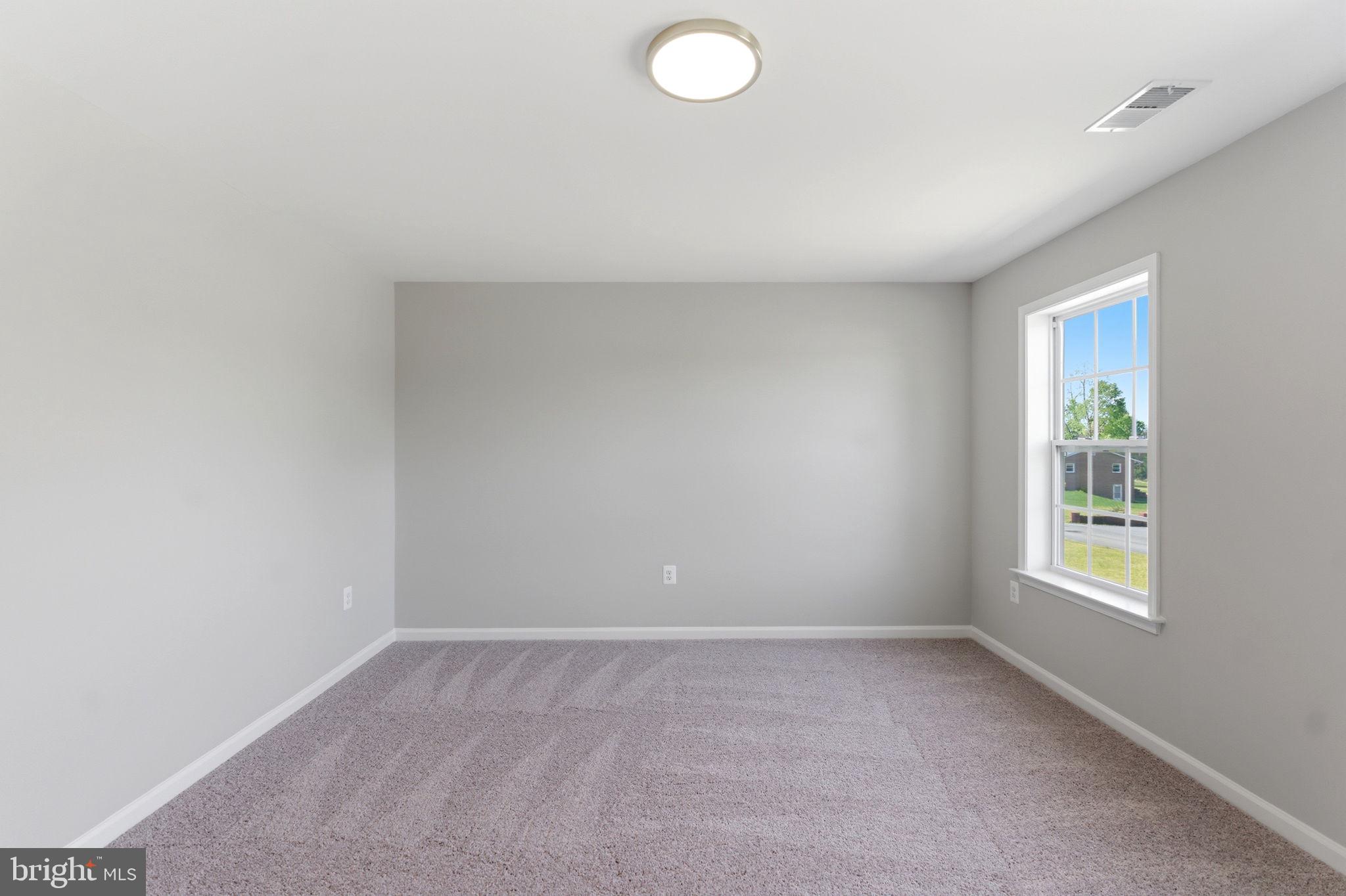 152 General Lee Avenue Inwood, WV 25428 - Photo 22 of 47 an empty room with windows