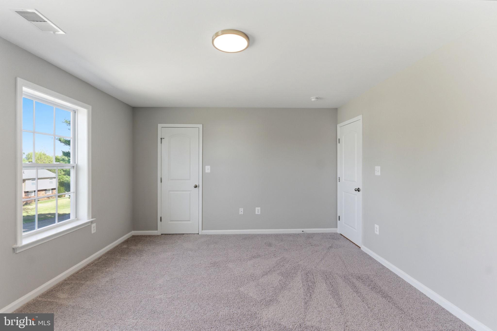 152 General Lee Avenue Inwood, WV 25428 - Photo 23 of 47 an empty room with windows and closet