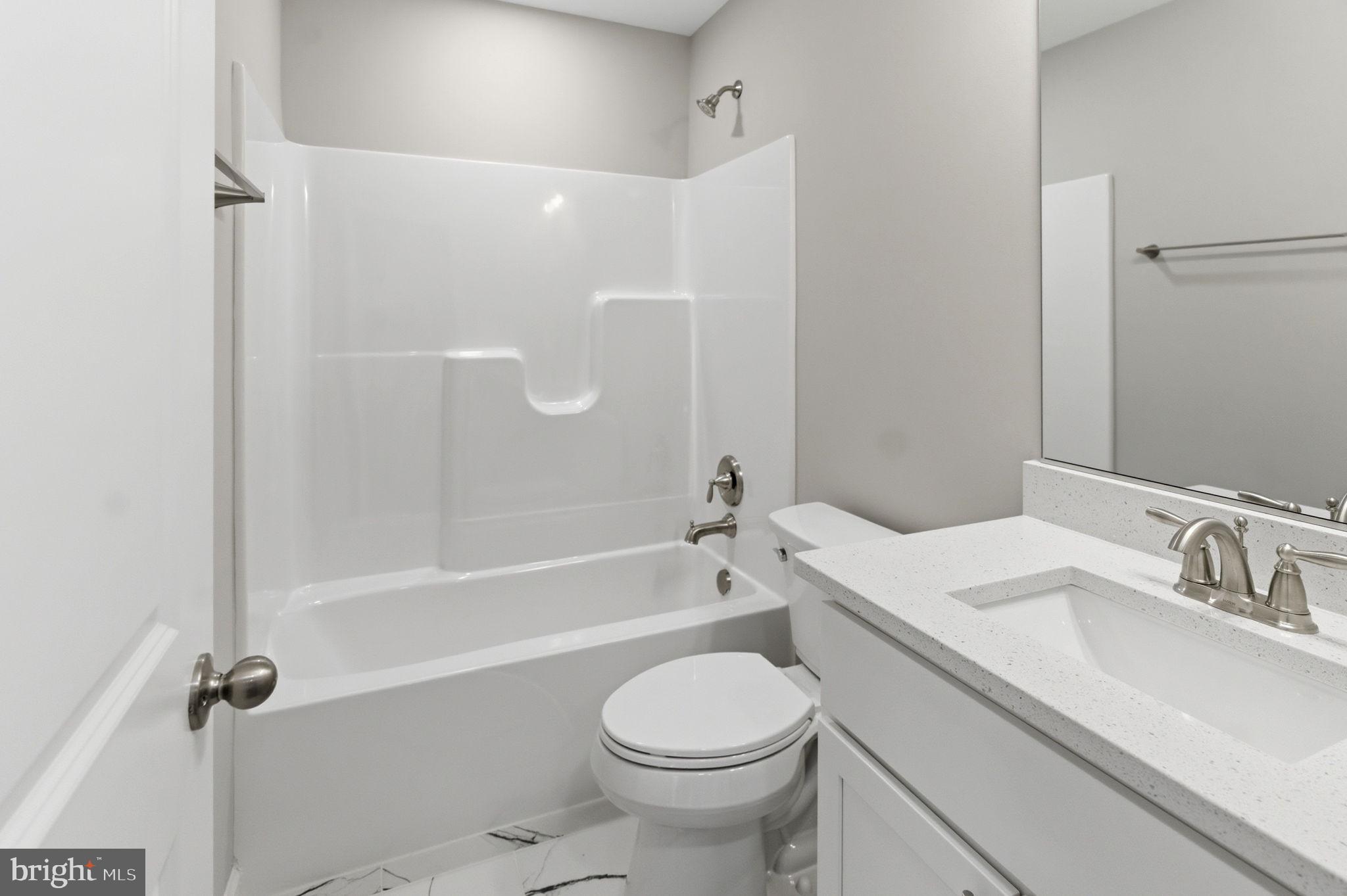 152 General Lee Avenue Inwood, WV 25428 - Photo 36 of 47 a bathroom with a sink toilet and shower