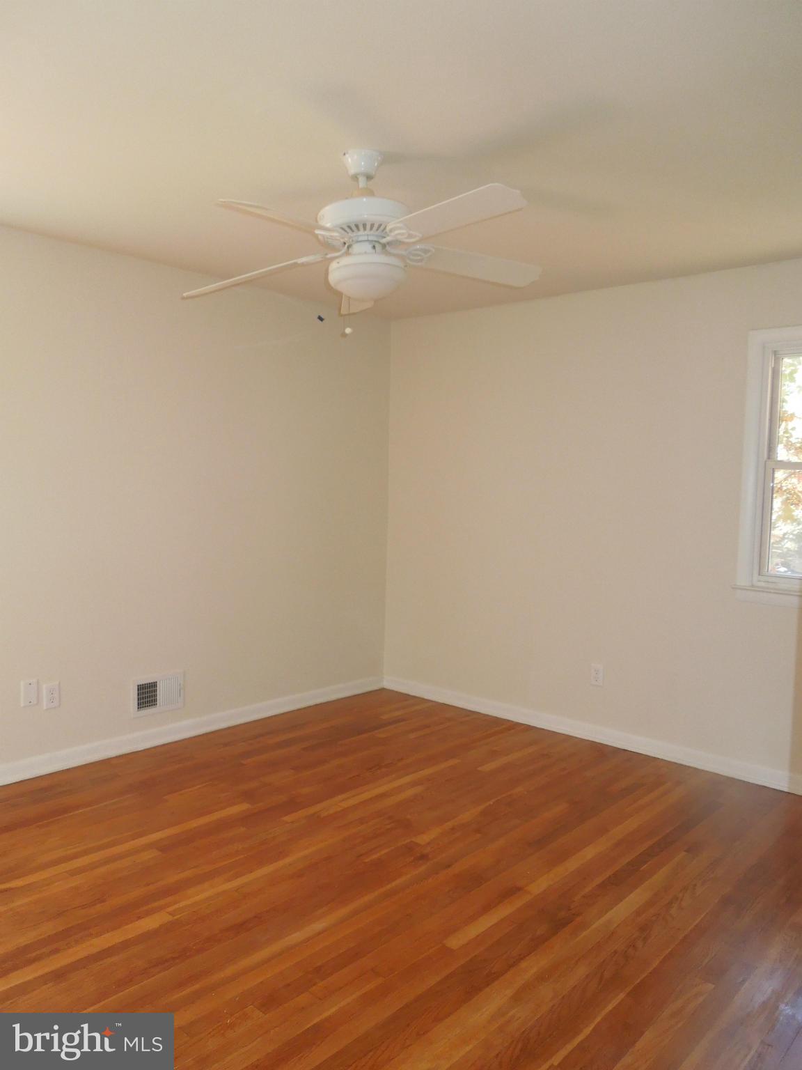 8457 New Cut Road Severn, MD 21144 - Photo 22 of 30 a view of empty room with wooden floor