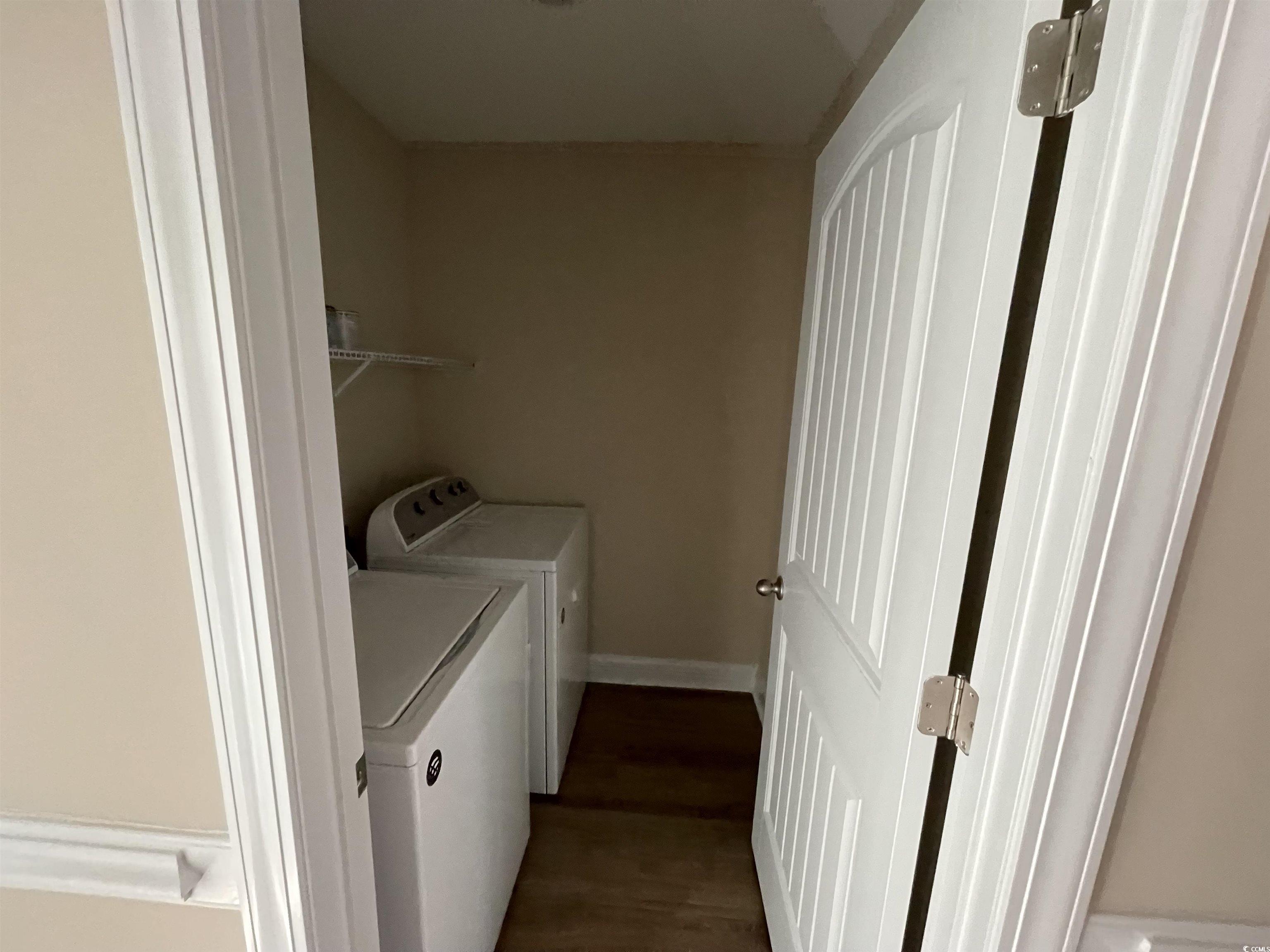 6765 Highway 66 Loris, SC 29569 - Photo 10 of 20 Washroom with dark wood-style floors, laundry area