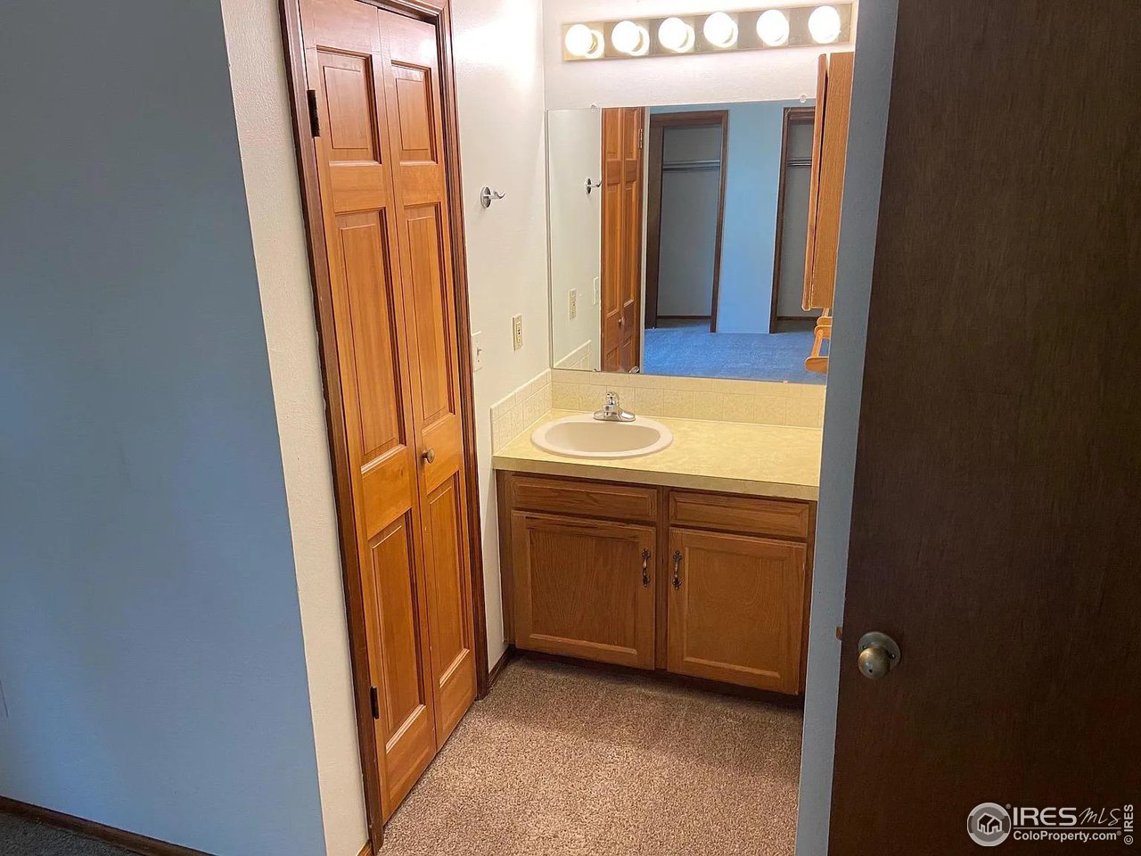 4885 Eisenhower Drive Boulder, CO 80303 - Photo 7 of 9 a bathroom with a sink and a mirror