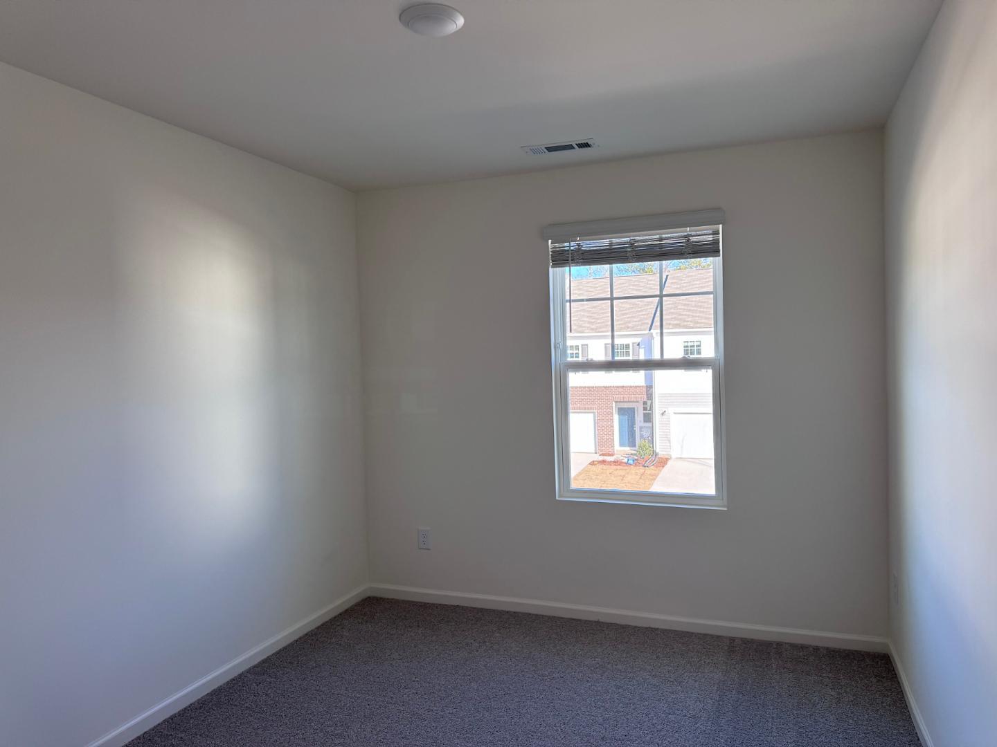 2002 Trailside Drive Durham, NC 27704 - Photo 11 of 14 an empty room with a window