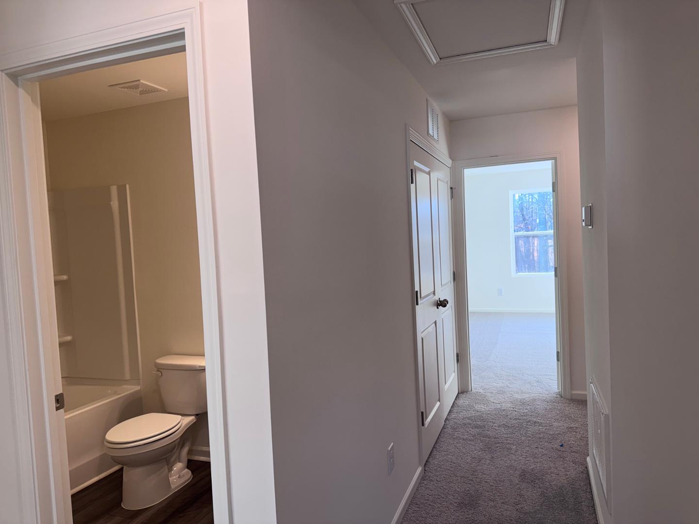 2002 Trailside Drive Durham, NC 27704 - Photo 5 of 14 a bathroom with a granite countertop toilet a sink and a mirror