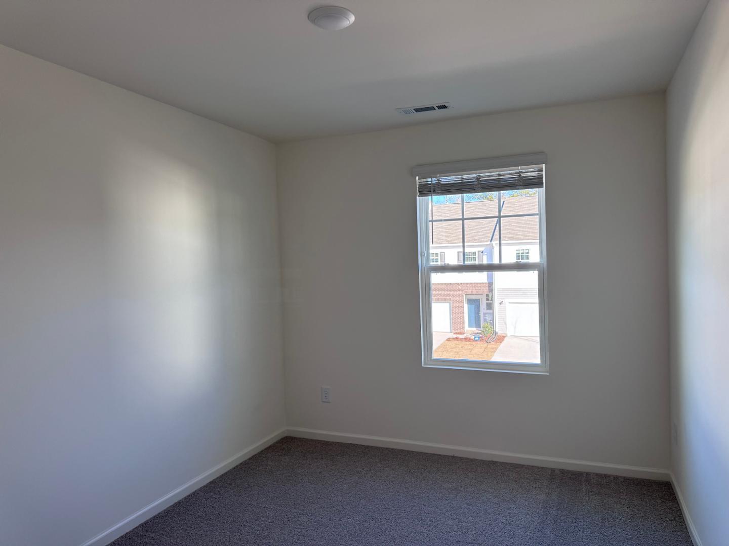 2002 Trailside Drive Durham, NC 27704 - Photo 10 of 14 an empty room with a window