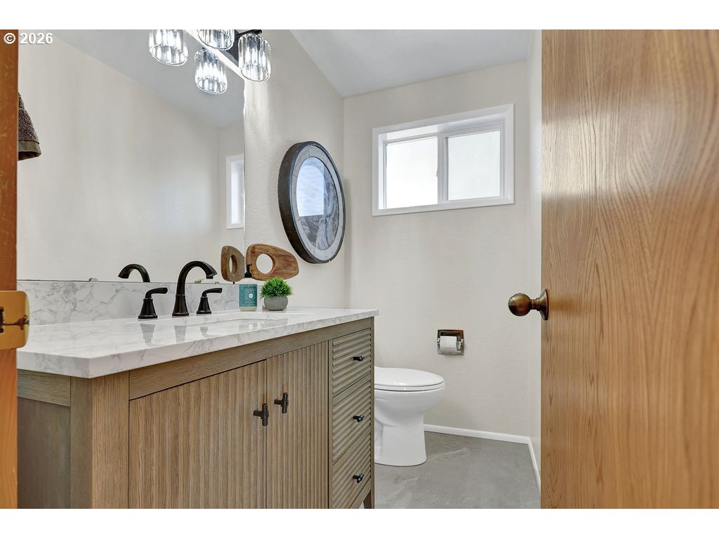 2372 South 22nd Court Florence, OR 97439 - Photo 26 of 33 a bathroom with a toilet sink and mirror