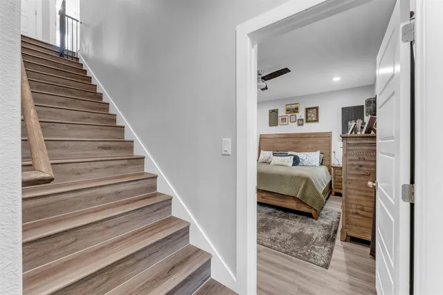 a bedroom with a bed and a view of bedroom