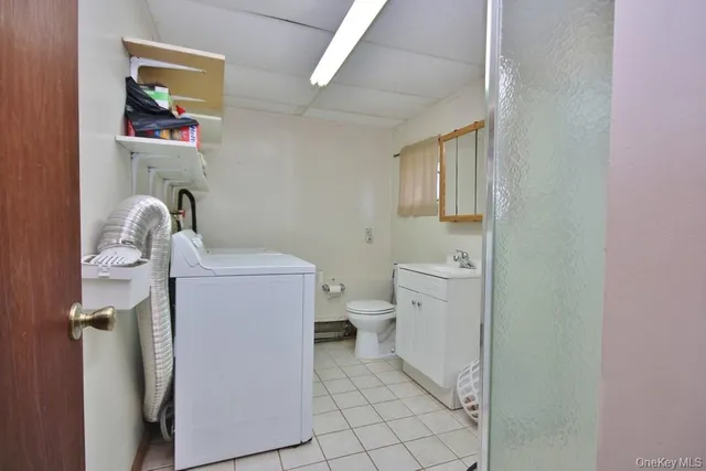 a utility room with dryer and washer