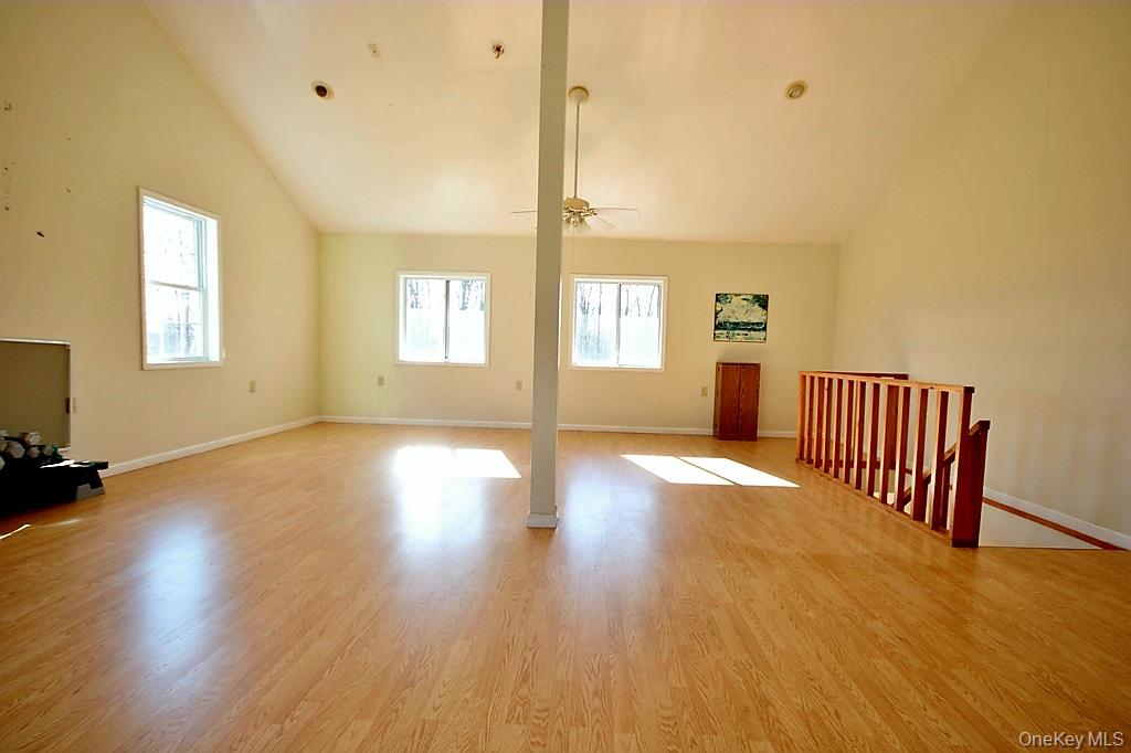 491 Hurd Road Swan Lake, NY 12783 - Photo 21 of 30 a view of a room with wooden floor and window