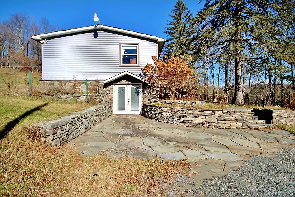 491 Hurd Road Swan Lake, NY 12783 - Photo 3 of 30 a front view of a house with a yard