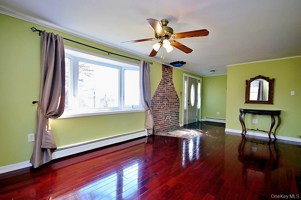 491 Hurd Road Swan Lake, NY 12783 - Photo 5 of 30 a living room with furniture and a window