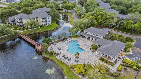an aerial view of house with a yard