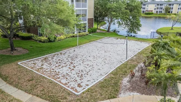 a view of a backyard with a lake view