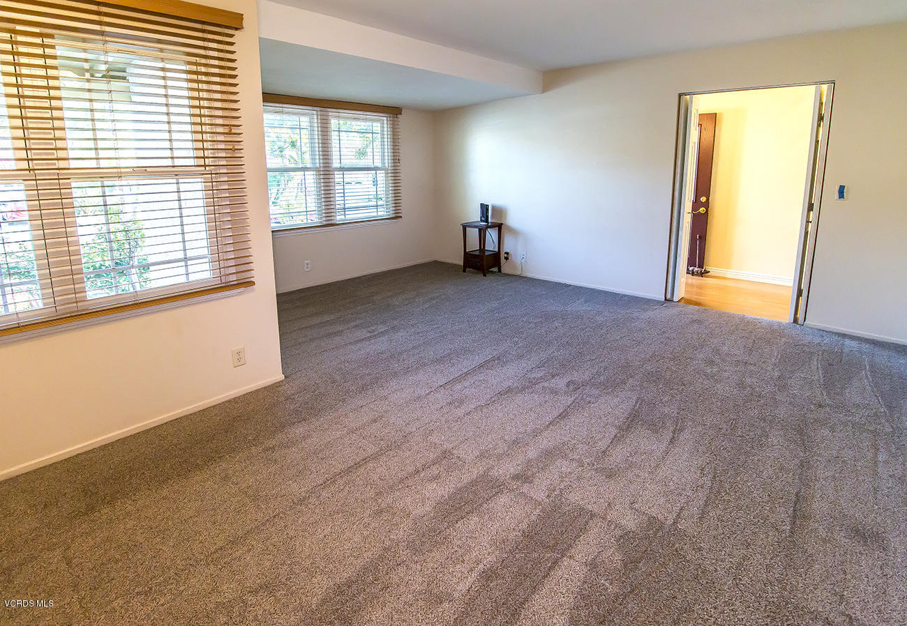1333 Rambling Road Simi Valley, CA 93065 - Photo 14 of 49 an empty room with windows and view of kitchen