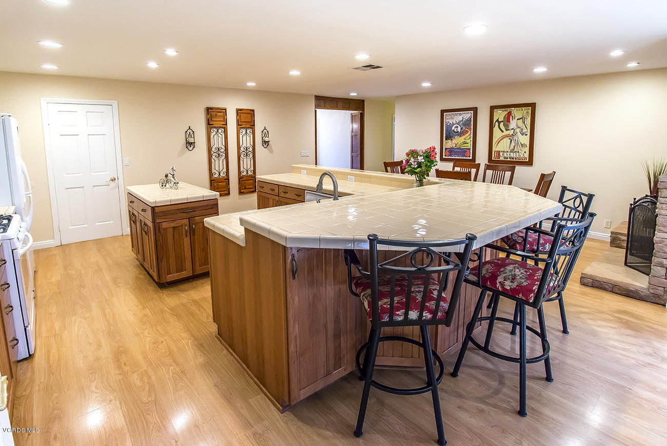1333 Rambling Road Simi Valley, CA 93065 - Photo 8 of 49 a large kitchen with a table and chairs